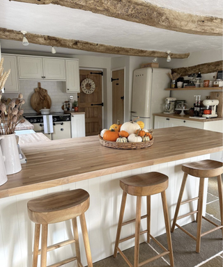 Kitchen with wooden island and wooden stools