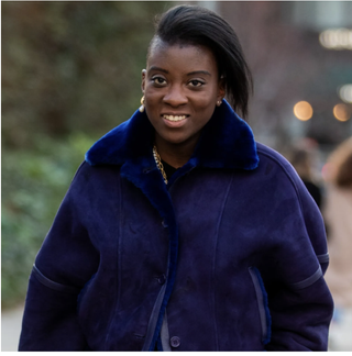 Nikki Ogunnaike wearing blue coat 