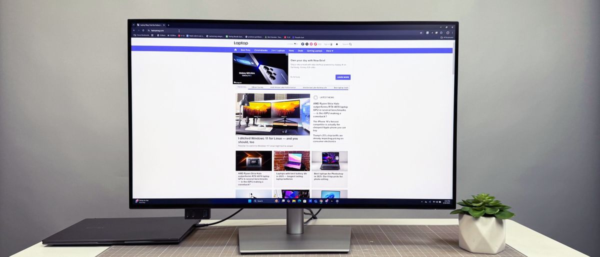 Dell UltraSharp 32 4K Thunderbolt Hub Monitor (U3225QE) on a white desk and gray background.