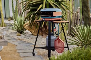 The blue Arc XL Gozney pizza oven from the Gozney x hedley & Bennett collection