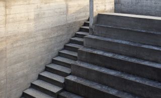 Concrete stairs divide spaces through height