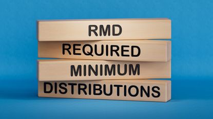 the word RMD and required minimum distributions on stacked wooden blocks