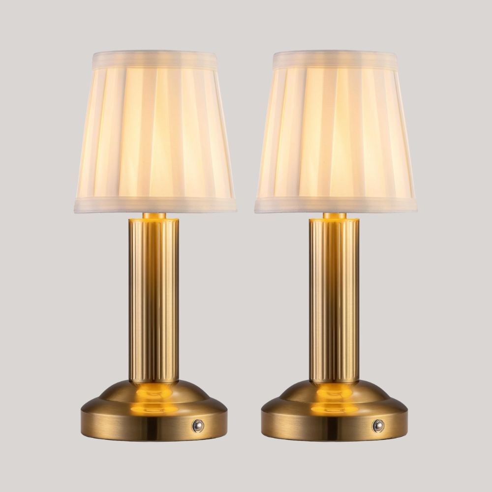 NEWSEE Store Pair of Elma Fabric Table Lamps in Gold against pale grey background.