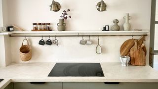 rustic kitchen with ledge shelf and vases