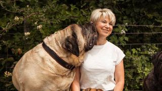 Helen&rsquo;s mastiff Neville licking her cheek