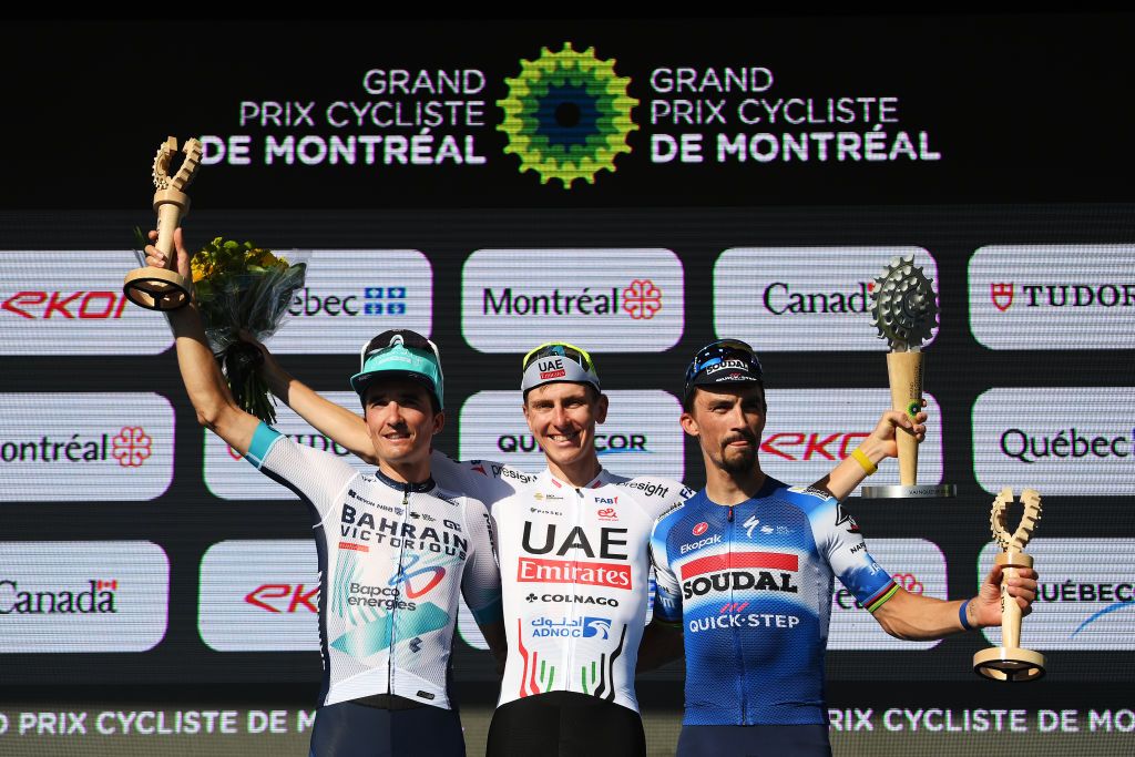 MONTREAL QUEBEC SEPTEMBER 15 LR Pello Bilbao of Spain and Team Bahrain Victorious on second place race winner Tadej Pogacar of Slovenia and UAE Team Emirates and Julian Alaphilippe of France and Team Soudal QuickStep on third place pose on the podium ceremony after the 13th Grand Prix Cycliste de Montreal 2024 a 2091km one day race from Montreal to Montreal UCIWT on September 15 2024 in Montreal Quebec Photo by Alex BroadwayGetty Images