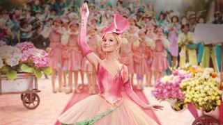 Wicked Poster featuring Glinda waving against a blurry background