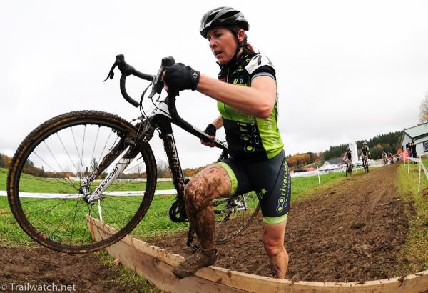Karin Holmen (Riverside Racing) running the barriers in the mud.