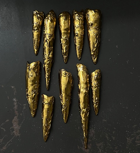Doechii's gold foil nails