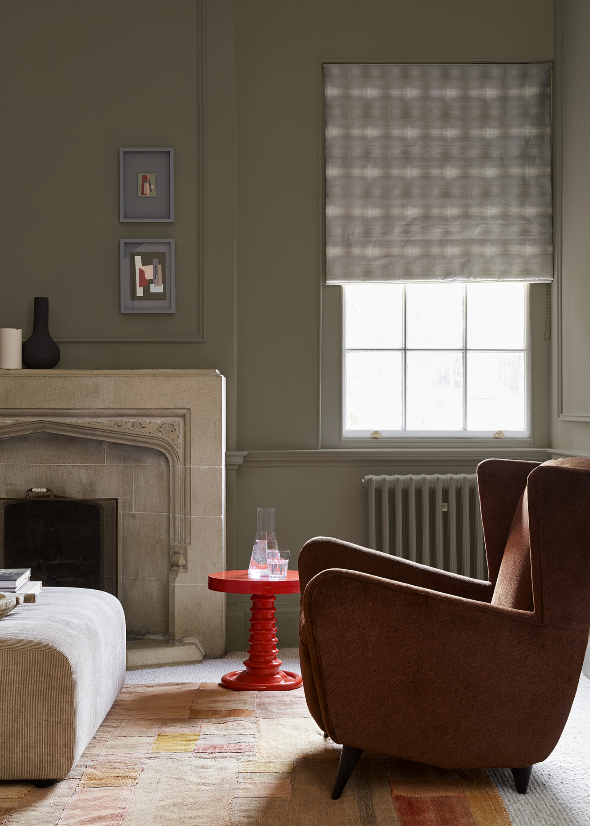 small green living room with a radiator and short blinds