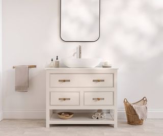 pale traditional bathroom with wood vanity unit