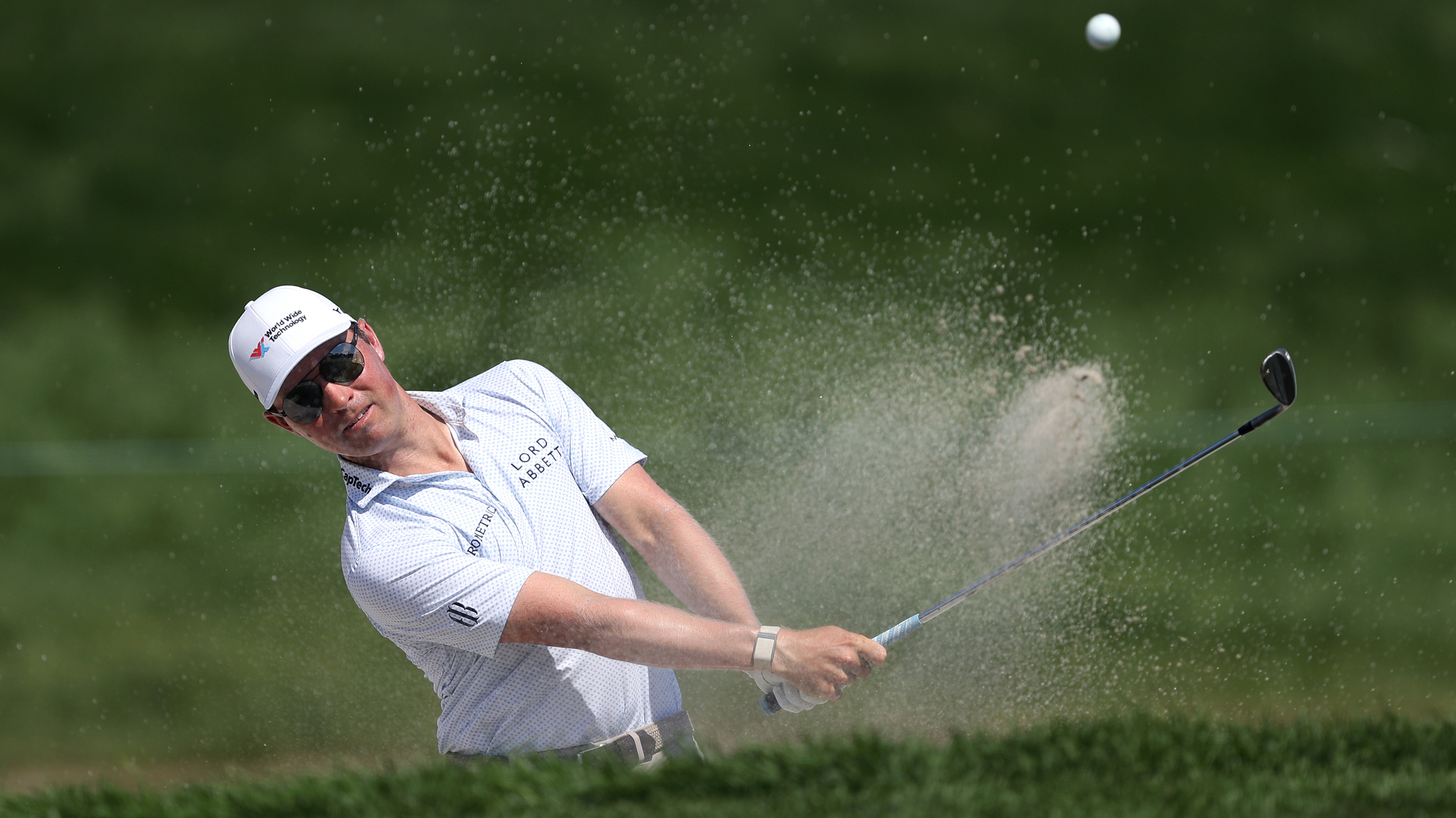 Ben Griffin hits a bunker shot during the 2025 Rocket Classic