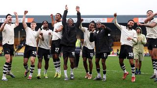 Port Vale players celebrate the teams victory following the Emirates FA Cup Fifth Round match between Port Vale and Sunderland on March 08, 2026 in Burslem, England.