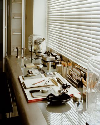 A long desk at Karl Lagerfeld's Paris apartment with various objects from the Sotheby's sale in December 2021
