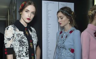 The motif of the rose jumped off the design duo's Guipure lace, and were cast in gold for the show's ornate gem-studded earrings and headpieces