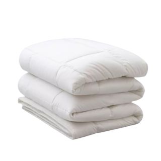 A large folded white filled comforter