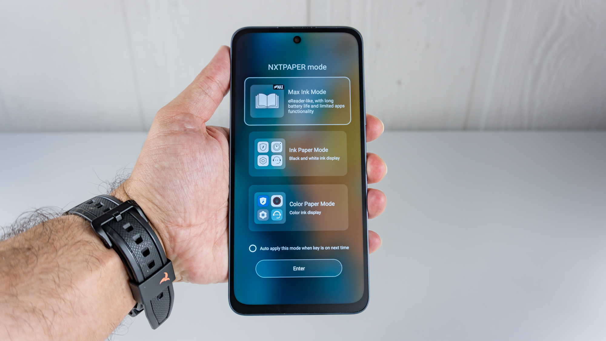 The TCL NXTPAPER 70 Pro in hand showing off the selection screen for its various NXTPAPER modes