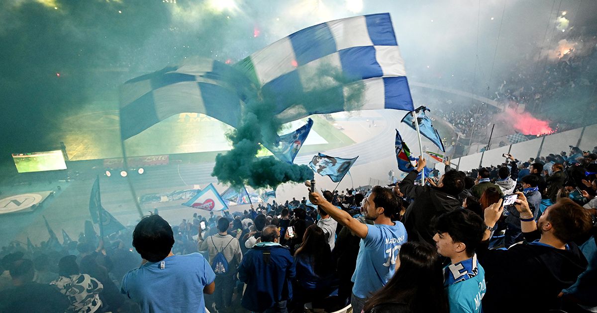 Fans of SSC Napoli celebrate their side&#039;s first goal scored by Victor Osimhen of SSC Napoli as they watch the Serie A match between Udinese Calcio and SSC Napoli live on a big screen at Stadio Diego Armando Maradona on May 04, 2023 in Naples, Italy.