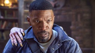 JAMIE FOXX as BUD JABLONSKI, with a vampire's hand on his shoulder, in Day Shift.