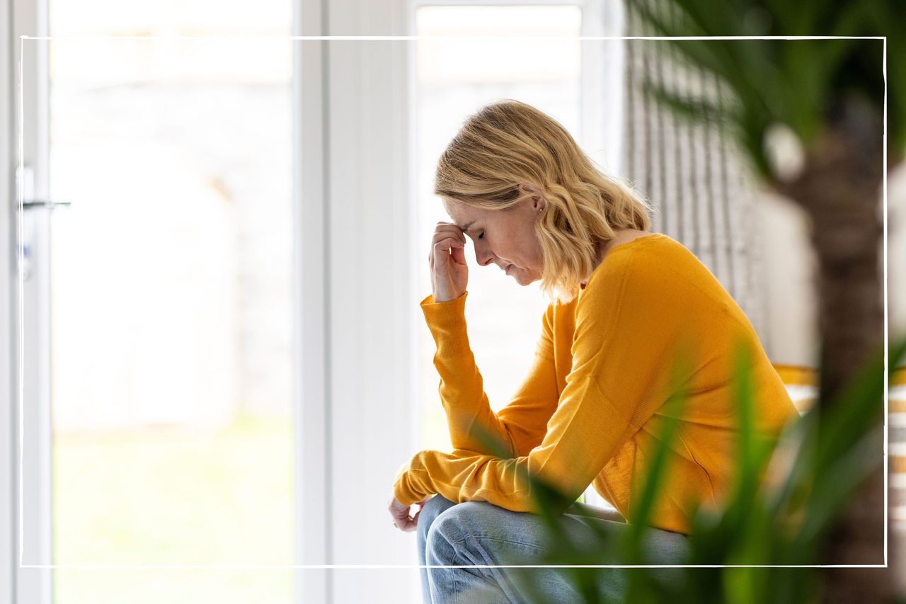 how to get rid of a headache fast illustrated by a woman holding her head and looking in pain