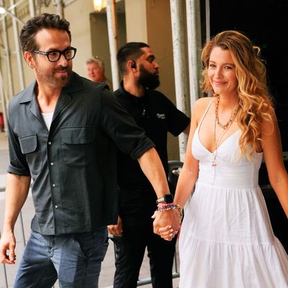 Blake Lively and Ryan Reynolds walk down the street in New York