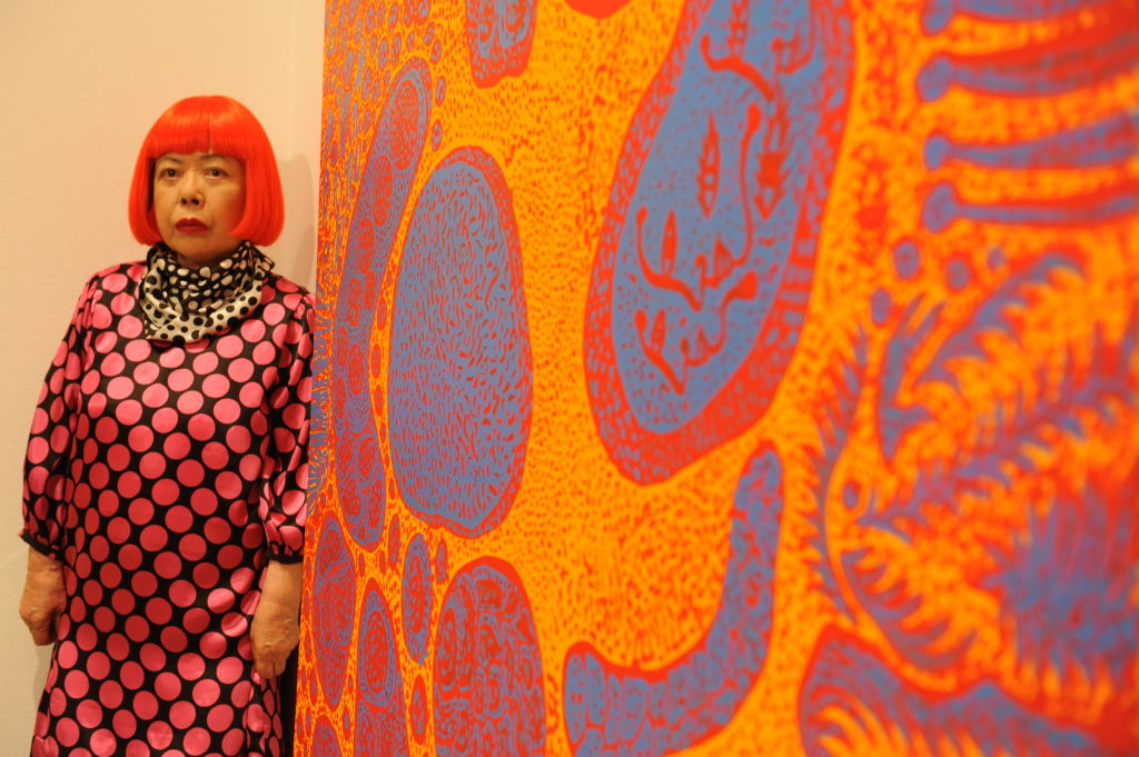 Yayoi Kusama standing next to a painting, New York, United States, 2012