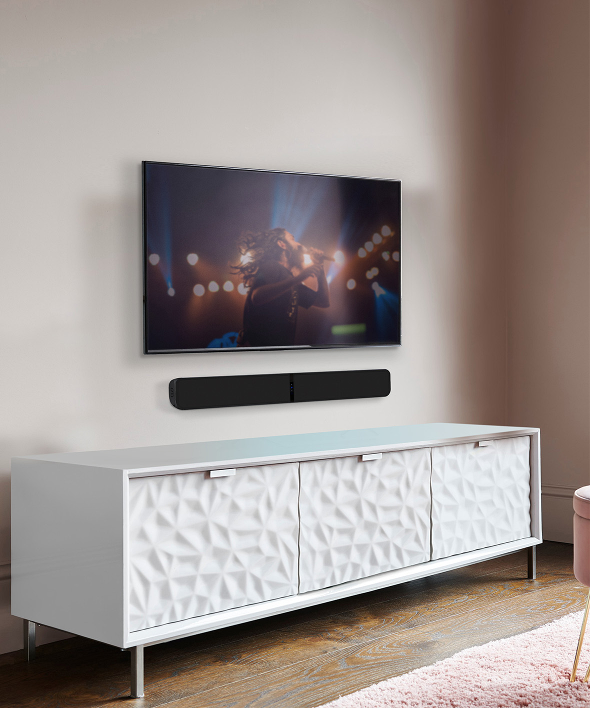 Soundbar wall mounted above a white sideboard