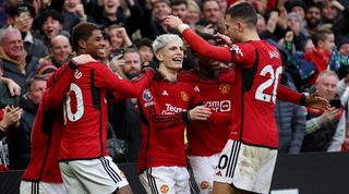 Manchester United players celebrate a goal against West Ham in February 2024.