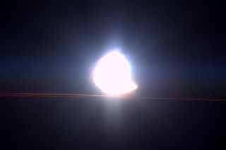 NASA astronaut Terry Virts took this image of a solar eclipse on March 20, 2015. The moon appears to take a bite out of the sun as it comes above the horizon.