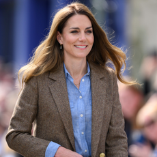Kate Middleton wearing tailored blazer and shirt with loose mocha bronde hair