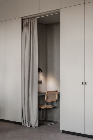 Private office space separated by curtain