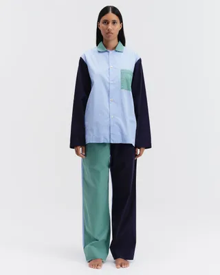 A workwear-inspired, utilitarian blue, green, white, and light blue pajama set.