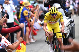 Tadej Pogacar attacks in the breakaway on stage 14 at the Tour de France