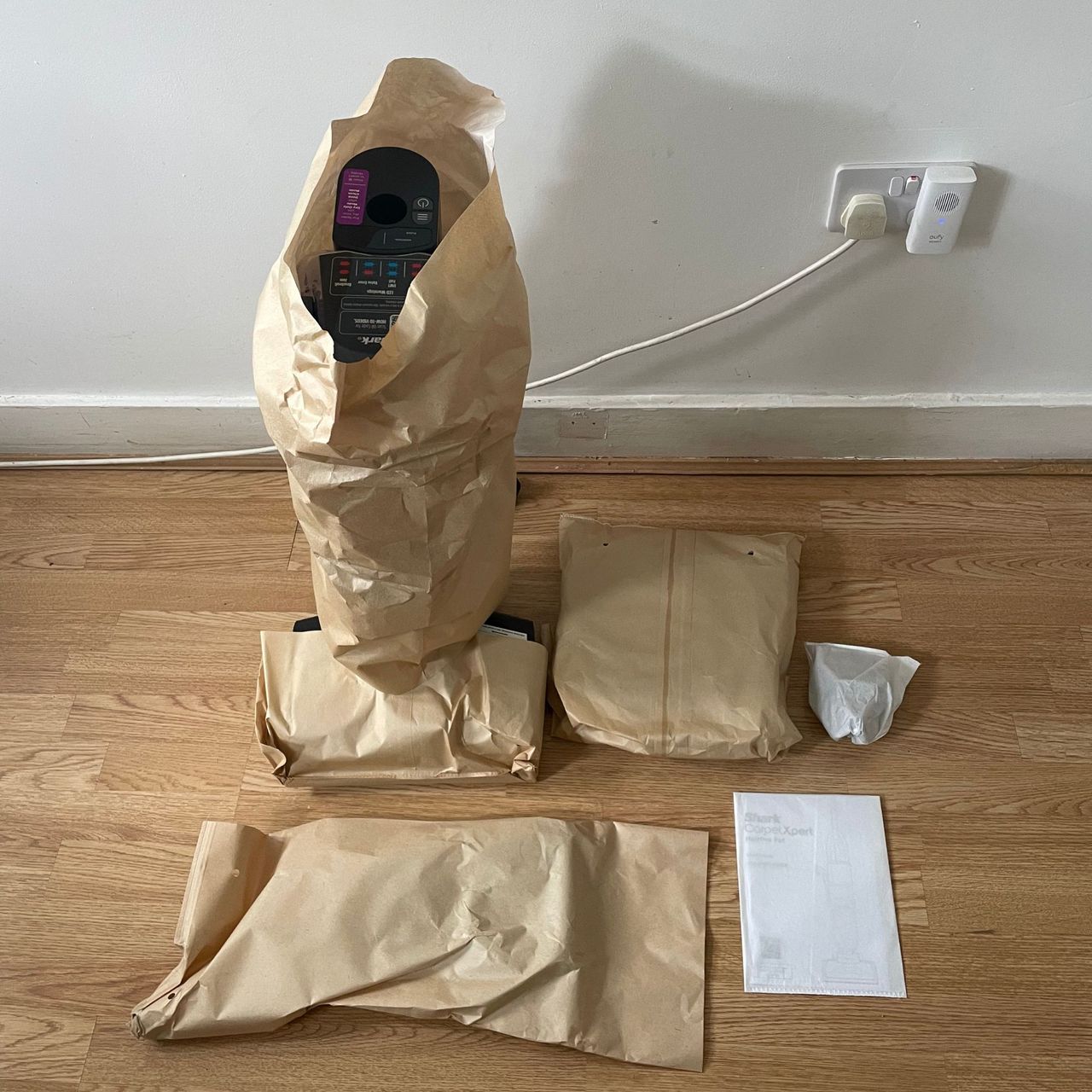 Shark CarpetXpert HairPro Pet Deep Carpet Cleaner with Spot Cleaner EX250UK components wrapped in paper on laminate flooring