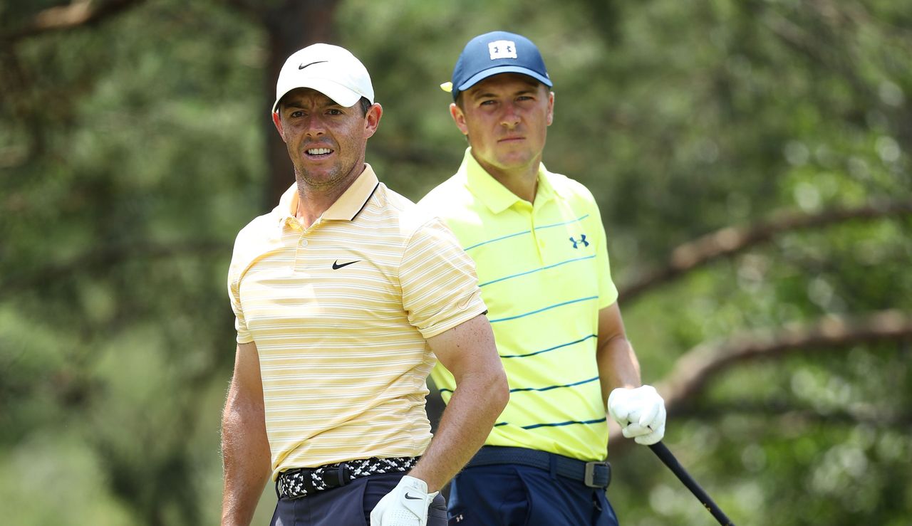 Rory McIlroy and Jordan Spieth watch on from the tee