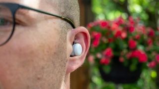 Wearing the Google Pixel Buds A-Series up close.