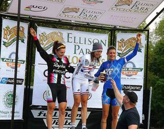 Helen Wyman (Kona) accepts a beer on the podium after her second win in as many days at Rohrbach's Ellison Park Cyclocross in Rochester.