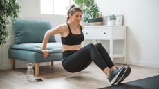 Woman exercising in domestic setting