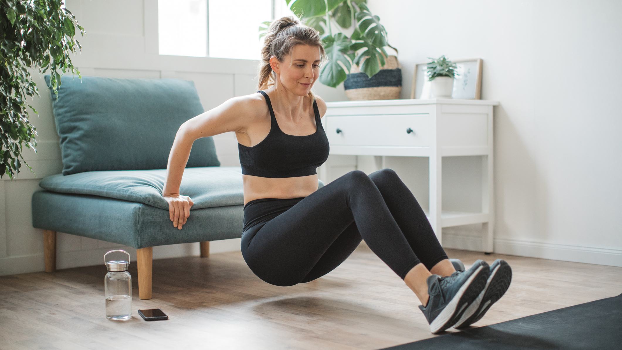 Woman exercising in domestic setting