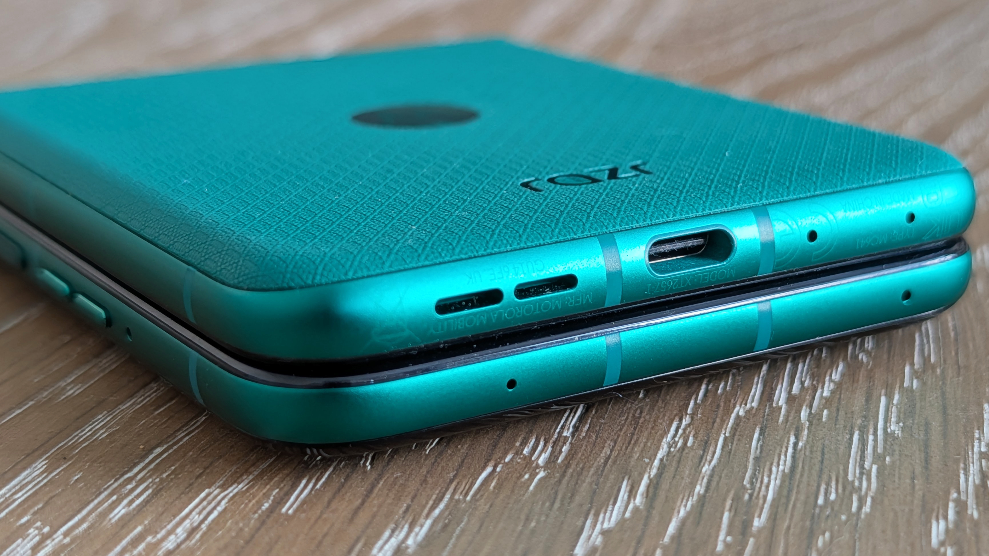 Motorola Razr 2026 in blue, being held in the hand
