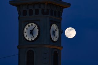 The Full Wolf Moon rises over clock tower in the Ipekyolu district of Van, Turkiye on Jan. 6, 2023.
