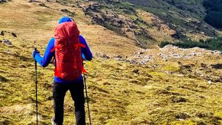 Man wearing Deuter Guide 44+8 mountaineering pack