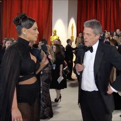 Ashley Graham and Hugh Grant at Oscars