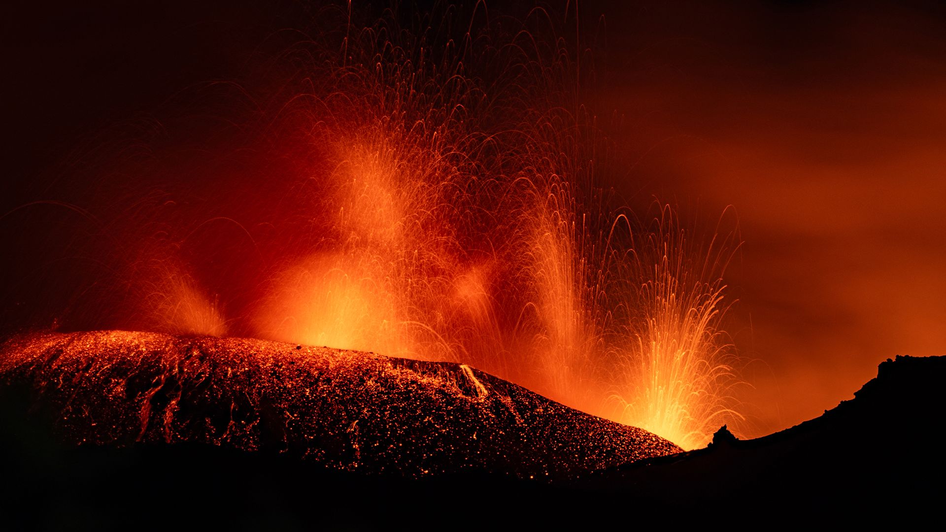 
                                Lava spews from the crater of Mount Etna in Sicily, Italy
                            