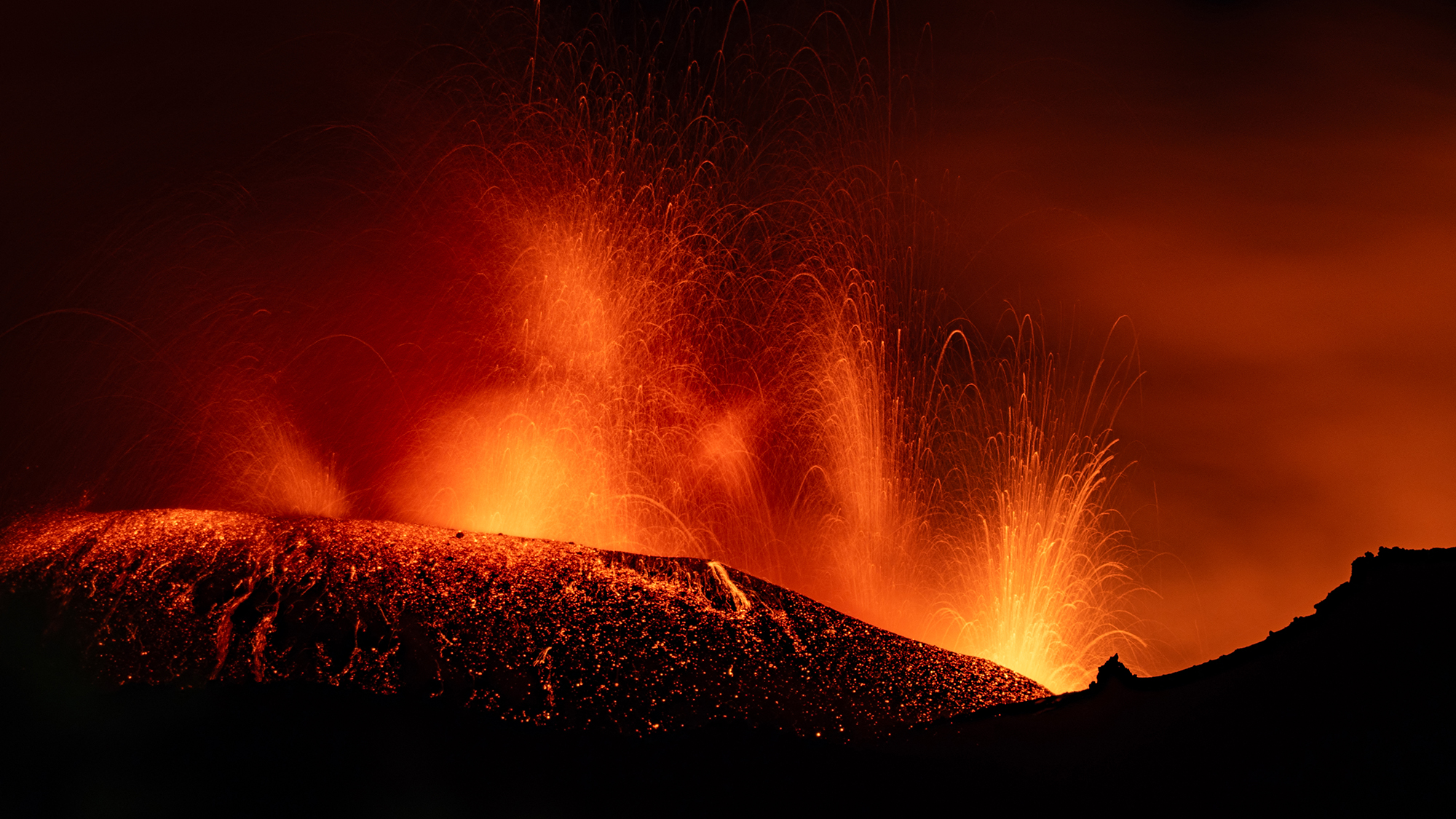 Lava spews from the crater of Mount Etna in Sicily, Italy