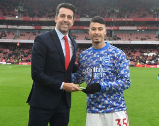 Gabriel Martinelli receives the Arsenal player of the month award from Arsenal Technical Director Edu the Premier League match between Arsenal and Burnley at Emirates Stadium on January 23, 2022 in London, England.