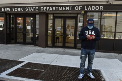 Luis Mora stands in front of the closed offices of the New York State Department of Labor on May 7, 2020 in the Brooklyn borough in New York City.