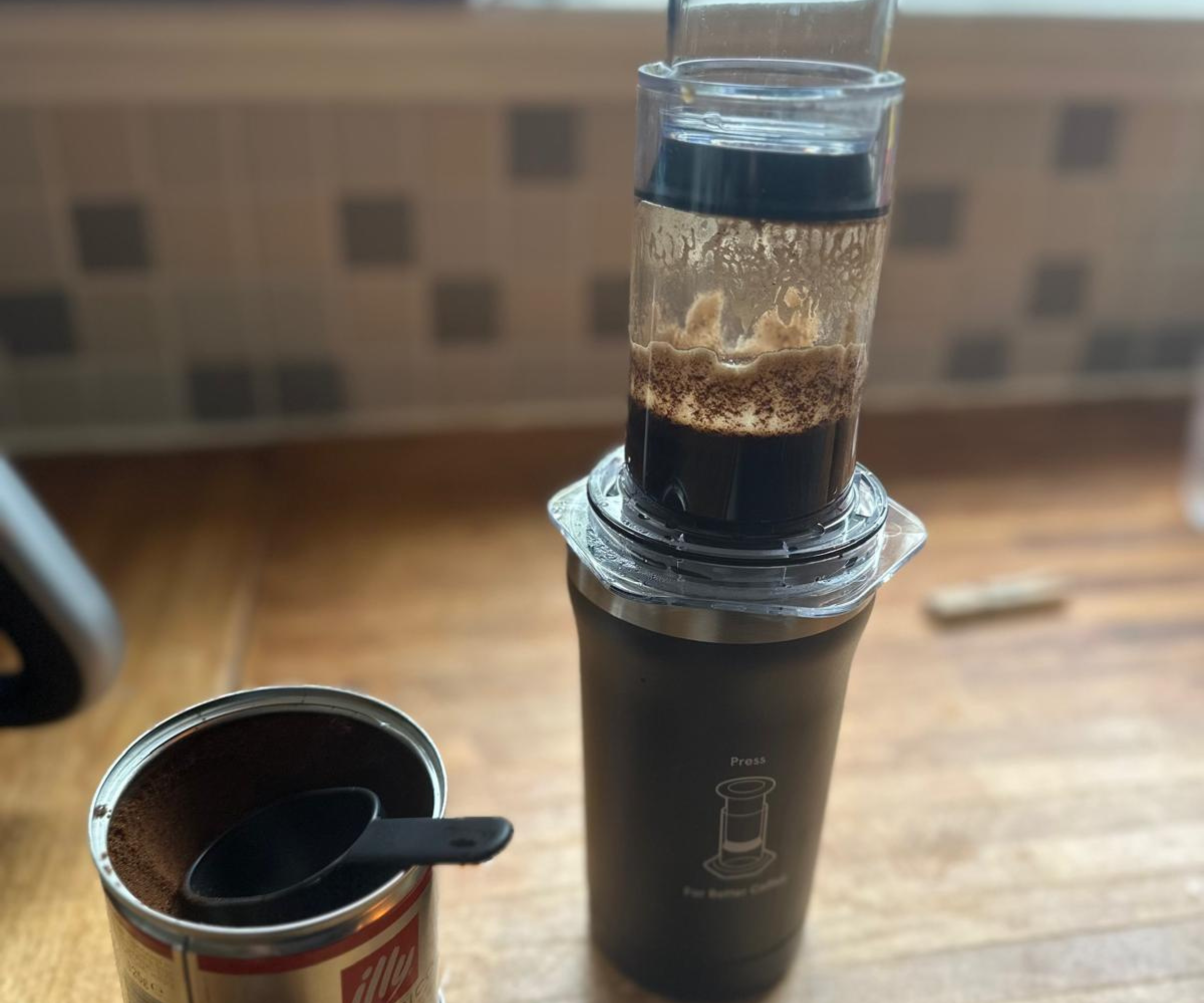 Pressing the coffee into the tumbler on the AeroPress Go Plus