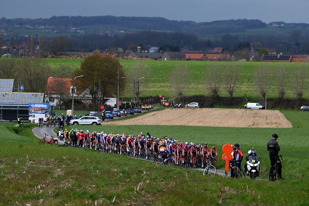 WAREGEM BELGIUM MARCH 29 A general view of the peloton passing through a landscape during the 77th Dwars Door Vlaanderen 2023 Mens Elite a 1837km one day race from Roeselare to Waregem DDV23 on March 29 2023 in Waregem Belgium Photo by Tim de WaeleGetty Images