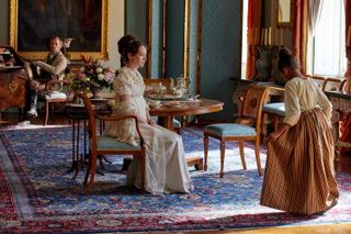 The characters of The Confessions of Frannie Langton in the drawing room of a stately home